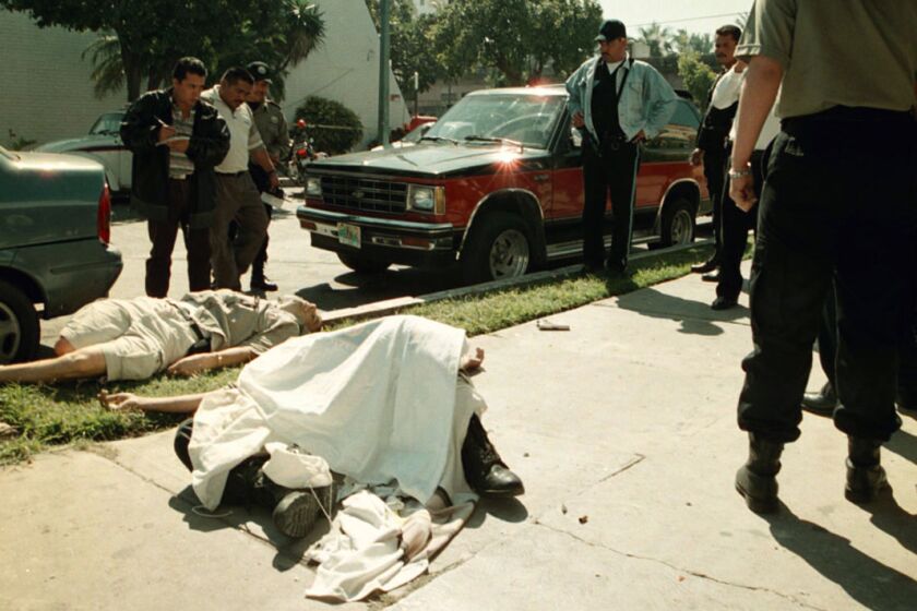 (Published 09/21/2003, G-1; published 12/08/2003, A-10) 02/10/2002 - The bodies of Ramon Arellano Felix (background) and Sinaloa state police agent Angel Antonio Arias are shown following a shootout Feb. 10, 2002, in Mazatlan, Mexico. The death of Ramon Arellano, chief executioner for the cartel, proved a decisive blow to the organization. Noroeste / Mazatlan
