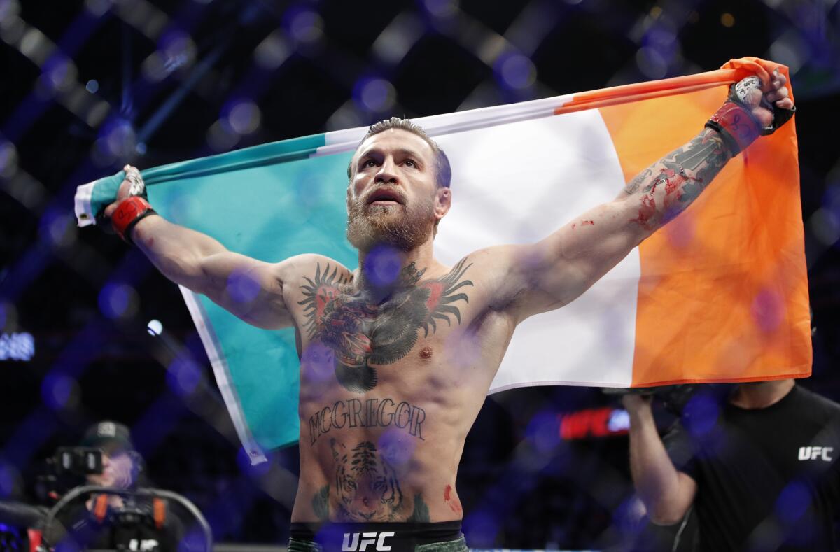 Conor McGregor celebrates after he beat Donald "Cowboy" Cerrone by technical knockout in 40 seconds at UFC 246 on Saturday night.
