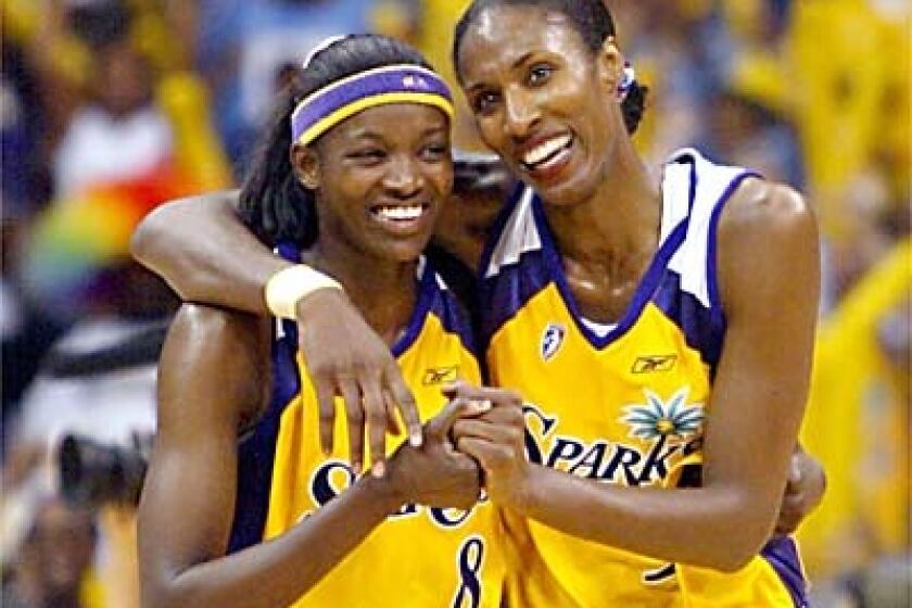 The Sparks lopsided victory over Starzz on Saturday gave DeLisha Milton, left, and Lisa Leslie, who scored 25 points, reason to smile.