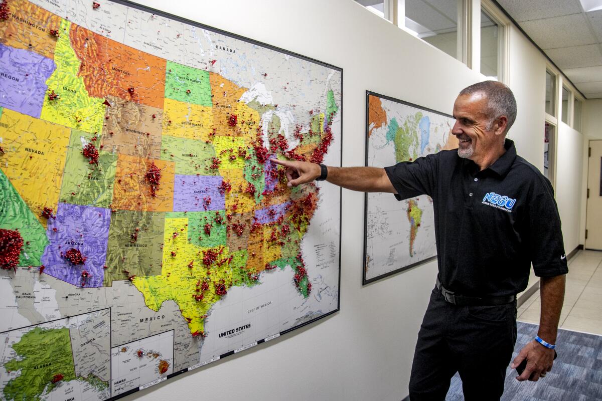 Foundation co-founder Erik Rees points out a map showing Joy Jar distribution nationwide.