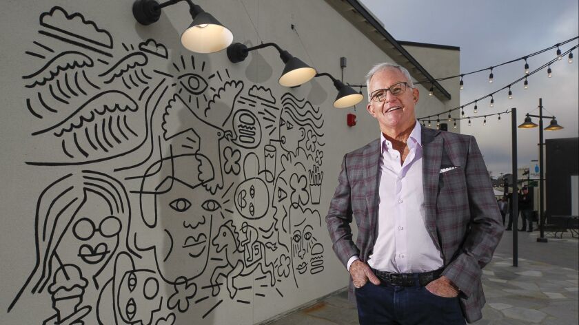 SAN DIEGO, February 28, 2019 | John Kilroy, president and CEO of Kilroy Realty Corporation, stands next to a mural on the Shake Shack restaurant, done by artist Eric Junker, at the retail portion of the One Paseo project in Carmel Valley.