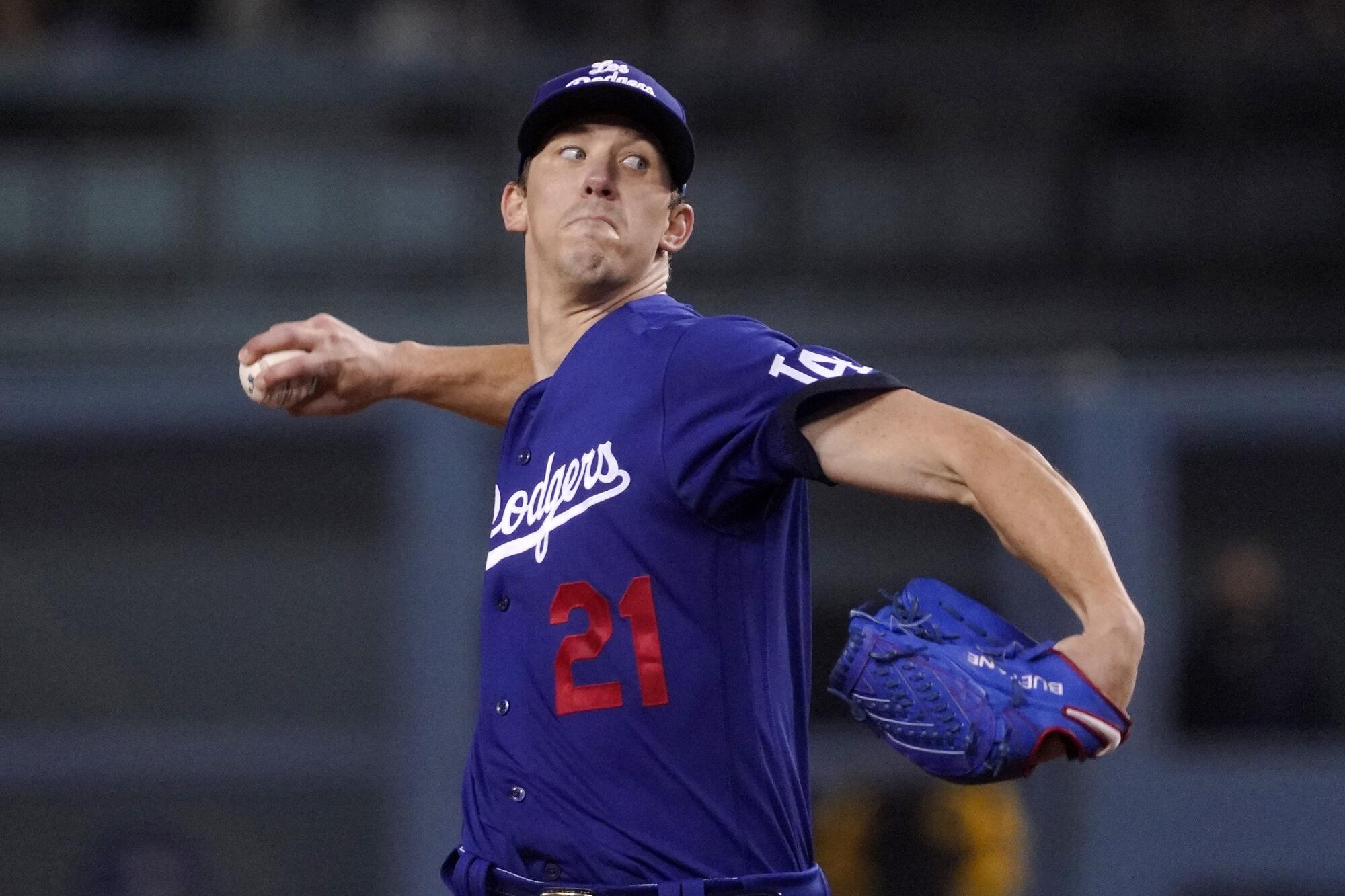 Los Angeles Dodgers starting pitcher Walker Buehler throws to the plate.