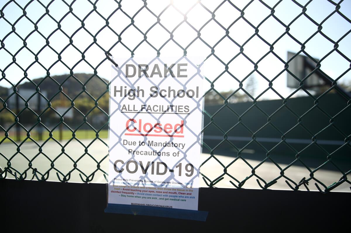 A coronavirus-related shutdown sign, posted outside Sir Francis Drake High School in San Anselmo, Calif.