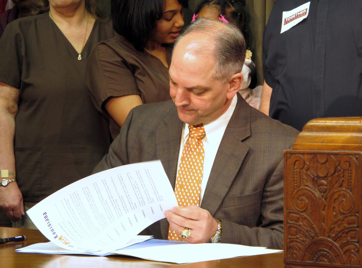 Louisiana Gov. John Bel Edwards on Tuesday signs an executive order on his first full day in office starting the process for expanding Louisiana's Medicaid program as allowed under the federal healthcare law.