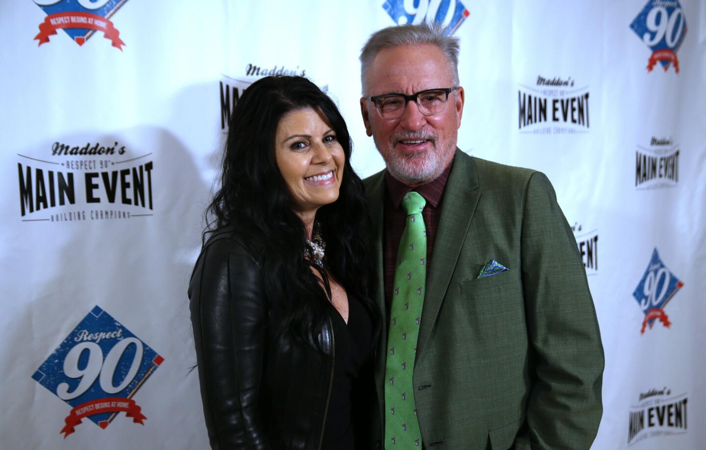 Jaye Maddon, left, and her husband, Cubs manager Joe Maddon, host the third annual Respect 90 Main Event charity boxing fundraiser at the Wintrust Bank building in Chicago on Thursday, Aug. 17, 2017.