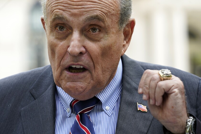 FILE - Former New York City Mayor Rudy Giuliani speaks during a news conference June 7, 2022, in New York. A heckler who clapped Giuliani on the back at a campaign event, Sunday, June 26, 2022, was arrested, jailed for more than 24 hours and now faces an assault charge. (AP Photo/Mary Altaffer, File)