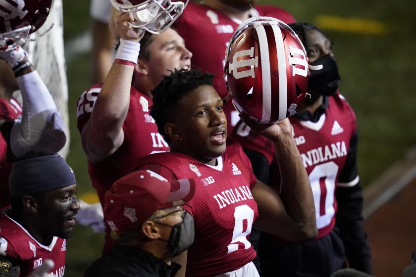 Quarterback Michael Penix (9) celebrates after Indiana defeated Penn State in overtime on Oct. 24, 2020.