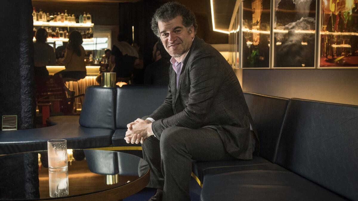 Paul Solomon, owner of Sam First Bar, sits in his new jazz club located steps from LAX.