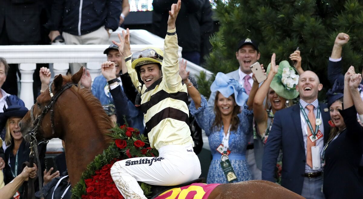 Jockey Flavien Prat celebrates aboard Country House after being declared the winner of the 145th Kentucky Derby.