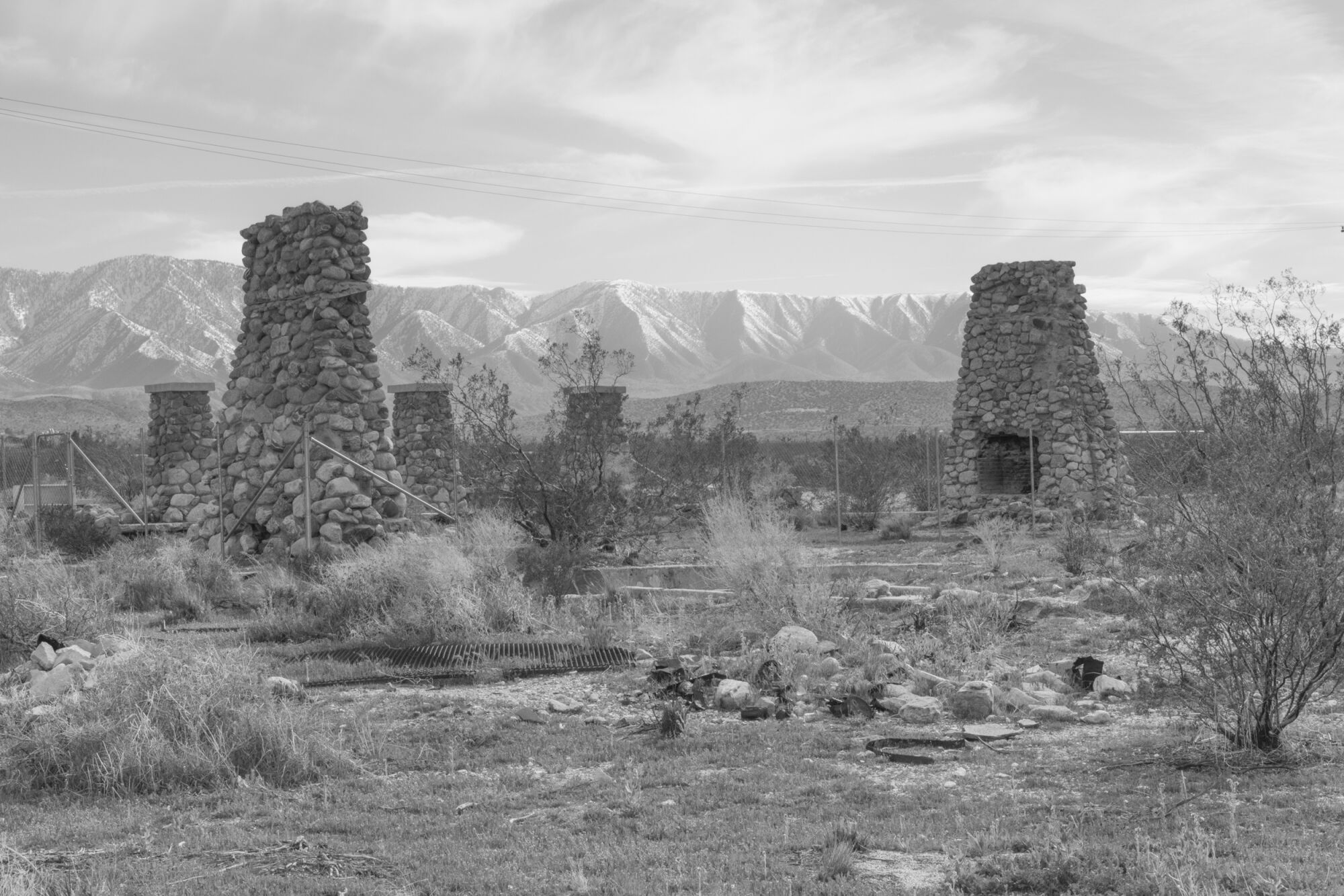 Ruins in the desert of the Antelope Valley, the mountains in the distance.