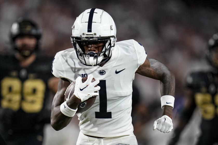 FILE 0 Penn State wide receiver KeAndre Lambert-Smith (1) scores a touchdown against Purdue during the second half of an NCAA college football game in West Lafayette, Ind., Thursday, Sept. 1, 2022. Former Penn State wide receiver KeAndre Lambert-Smith is planning to transfer to Auburn. Lambert-Smith announced his commitment to the Tigers on social media Wednesday, April 24, 2024. (AP Photo/Michael Conroy, File)