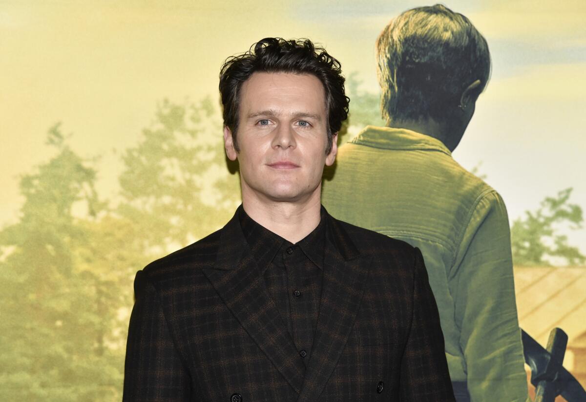 Jonathan Groff attends a movie premiere wearing all black