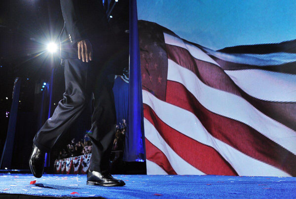 President Obama walks off the stage following his victory speech on election night in Chicago.