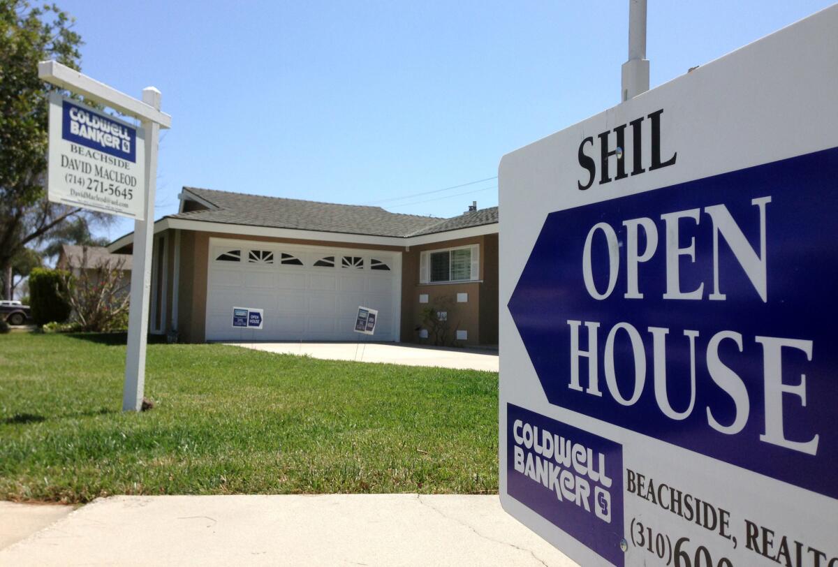 The housing market is heading for a slower, more stable recovery, says a new study out Thursday. Above, an open house in Huntington Beach in May.