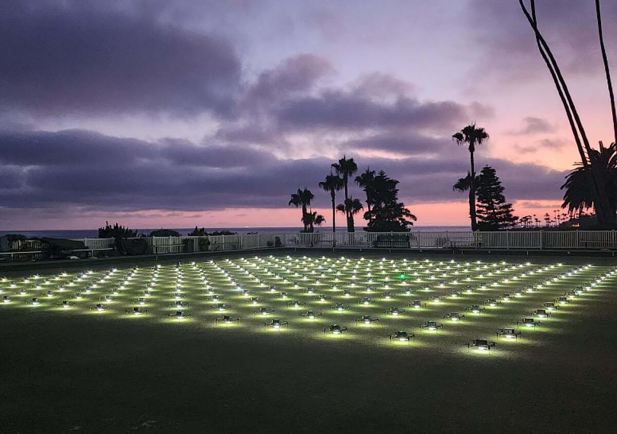 Drones rest on the lawn bowling greens in Heisler Park in Laguna Beach on Thursday.