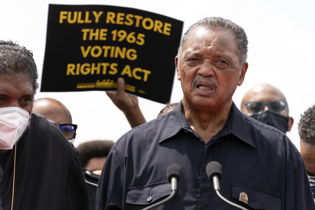 The Rev. Jesse Jackson speaks to a crowd during a voting rights demonstration on Capitol Hill.