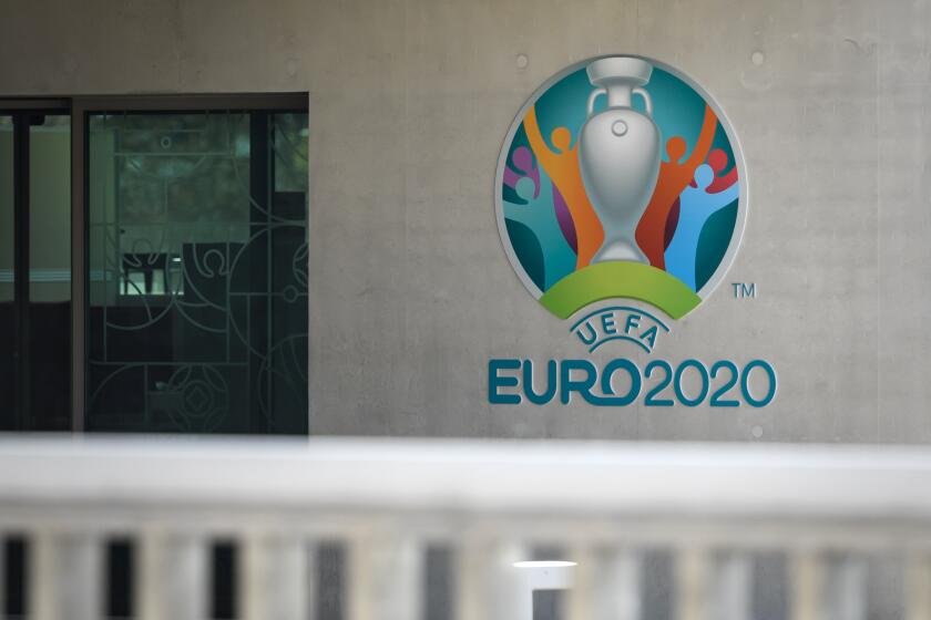 This photograph taken in Nyon on March 17, 2020, shows the Euro 2020 logo at the headquarters of UEFA, the European football's governing body, amid spread of novel coronavirus (COVID-19). - UEFA has proposed postponing the European Championship, due to take place across the continent in June and July this year, until 2021 at crisis meetings on Tuesday, a source close to European football's governing body told AFP. (Photo by FABRICE COFFRINI / AFP) (Photo by FABRICE COFFRINI/AFP via Getty Images)