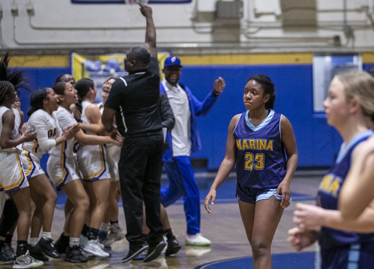 Marina's Rylee Bradley leaves the court after the Vikings lost to Gahr in a playoff game.