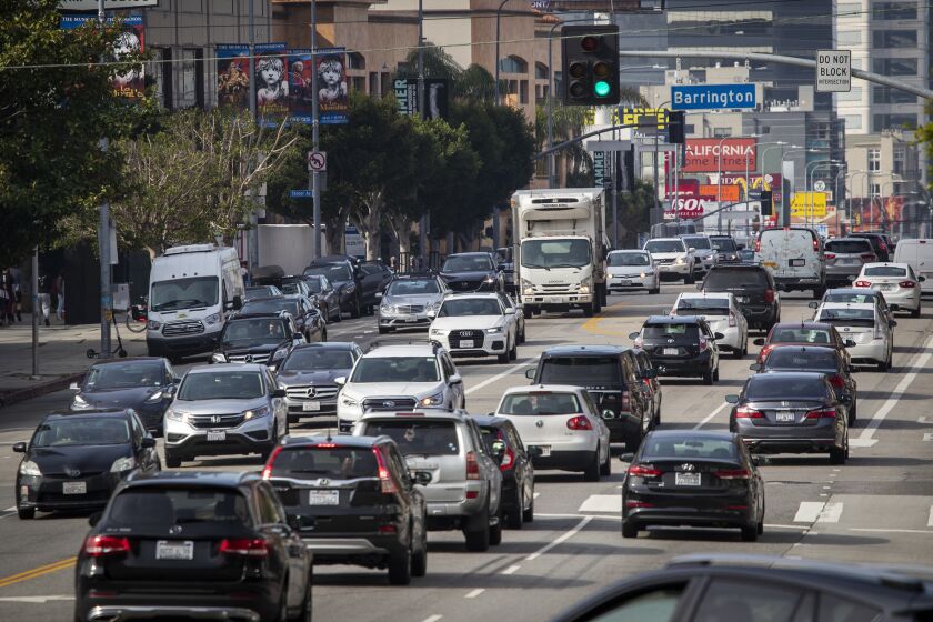 LOS ANGELES, CALIF. -- WEDNESDAY, MARCH 27, 2019: Heavy traffic congestion moves slowly during morning rush hour along Wilshire Blvd., one of the westside's busiest corridors, west of the 405 in Los Angeles, Calif., on March 27, 2019. Would you pay $4 to drive to the Westside if the fee reduced traffic jams? Charging a fee to enter the Westside in a car during morning and evening rush hours could reduce traffic delays by 20%, according to a new study by the Southern California Assn. of Governments has found. (Allen J. Schaben / Los Angeles Times)