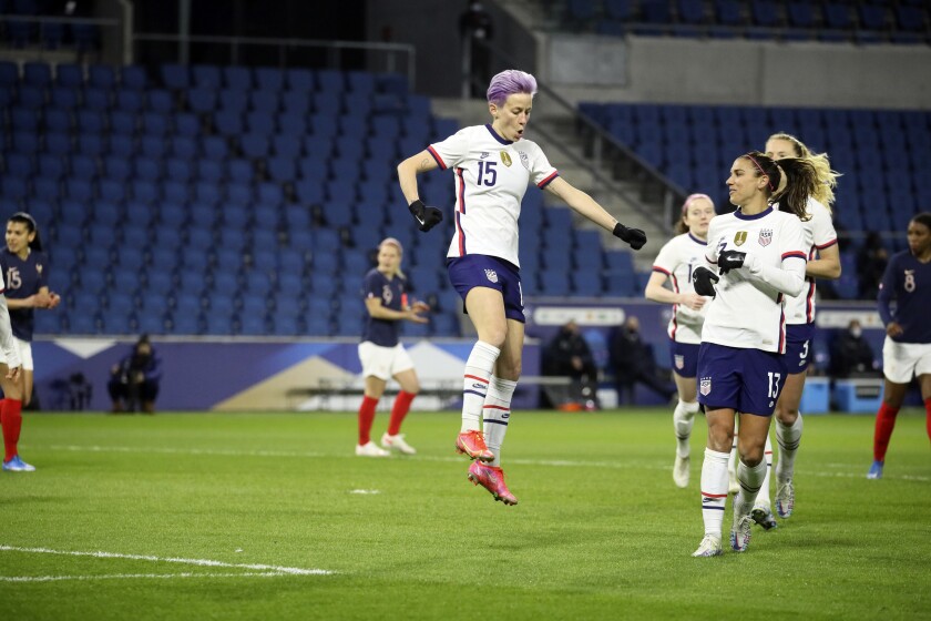United States' Megan Rapinoe (15) celebrates after scoring on a penalty kick during the first half of an international friendly women's soccer match between the United States and France in Le Havre, France, Tuesday, April 13, 2021. (AP Photo/David Vincent)