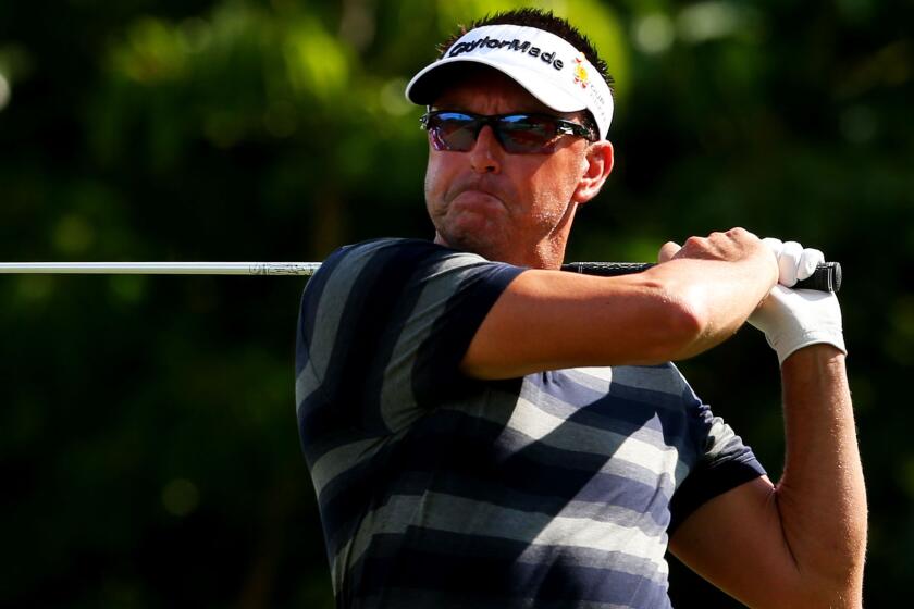 Robert Allenby tees off on the fifth hole during the second round of the Sony Open in Honolulu on Thursday.