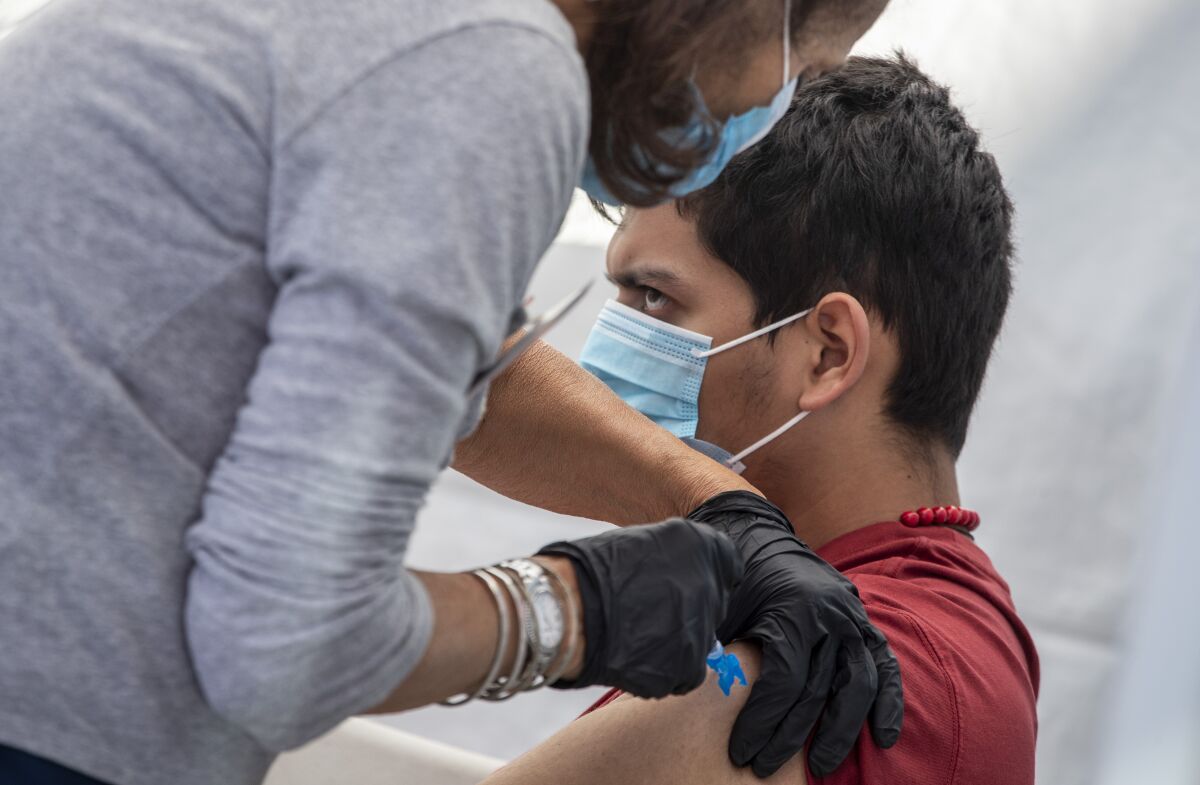 A man receives a COVID-19 vaccine