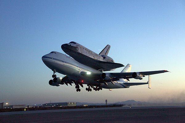The space shuttle Discovery hitches a ride back to Florida atop a modified Boeing 747. The shuttle touched down at Edwards Air Force Base earlier this month after bad weather prevented it from landing at Kennedy Space Center.