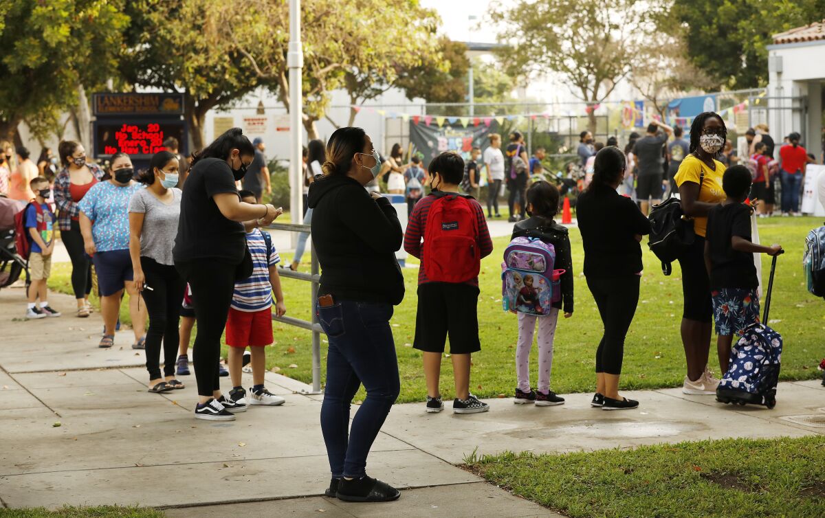 Parents and students line up to enter Lankershim Elementary School in North Hollywood.