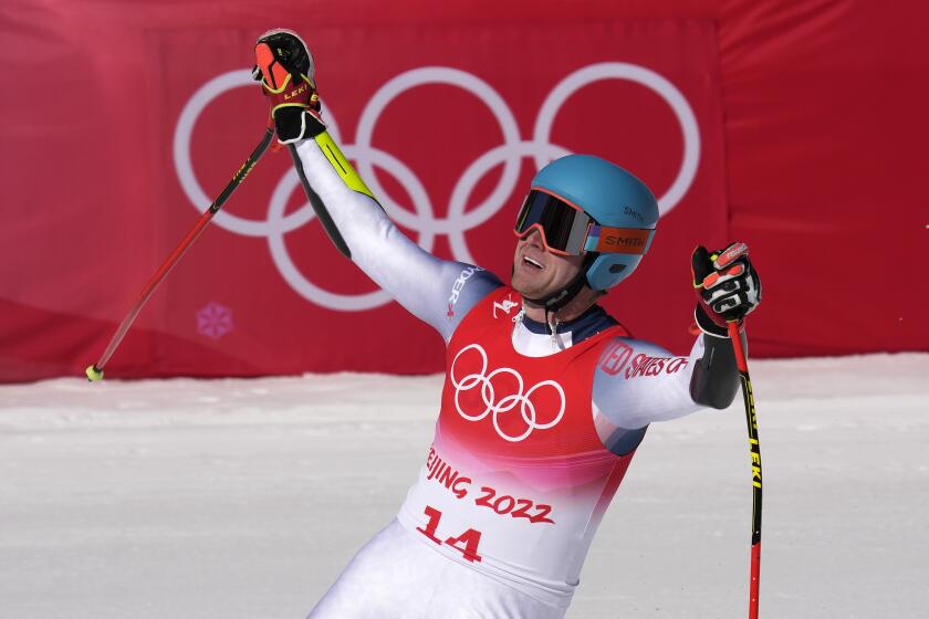 Ryan Cochran-Siegle of the United States reacts after finishing the the men's super-G at the 2022 Winter Olympics, Tuesday, Feb. 8, 2022, in the Yanqing district of Beijing. (AP Photo/Luca Bruno)