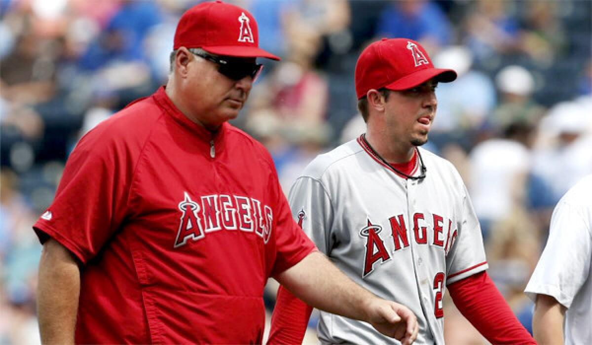 Sean Burnett's second visit to Dr. James Andrews didn't end with a surgical procedure, but the Angels left-hander has been ordered not to pick up a ball for a month.