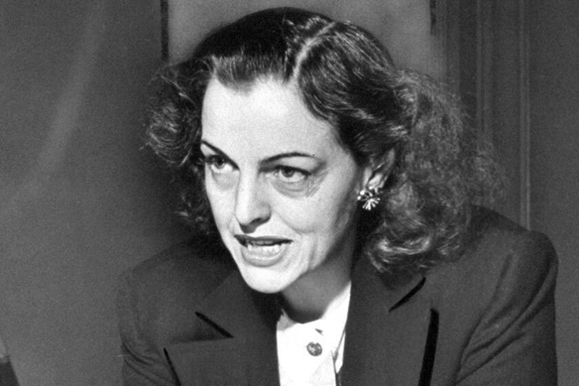 Helen Gahagan Douglas speaks during a news conference in 1950.