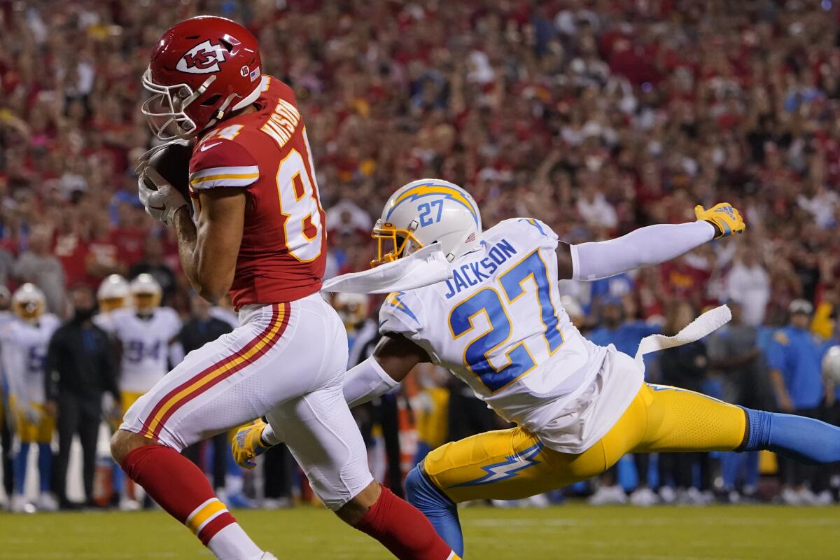 Chiefs  receiver Justin Watson catches a touchdown pass as Chargers cornerback J.C. Jackson (27) is too late to defend.