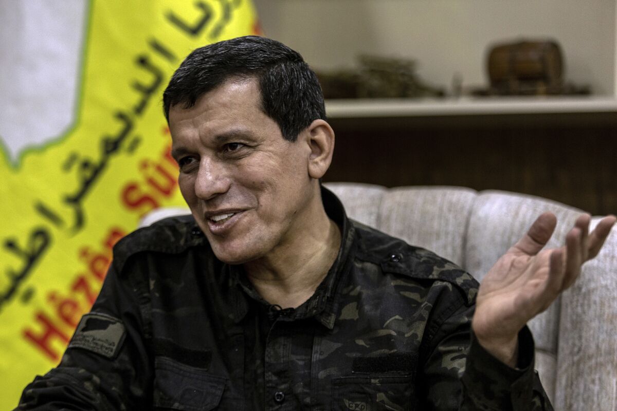 General Mazloum Abdi, the commander of the U.S.-backed Syrian Democratic Forces, speaks during an interview with the Associated Press in Hassakeh, Syria, Thursday, Feb. 10, 2022. Abdi said the Islamic State is a growing threat to northeast Syria in the aftermath of a deadly prison attack and unless immediate action is taken, the extremist group will again flourish. (AP Photo/Baderkhan Ahmad)