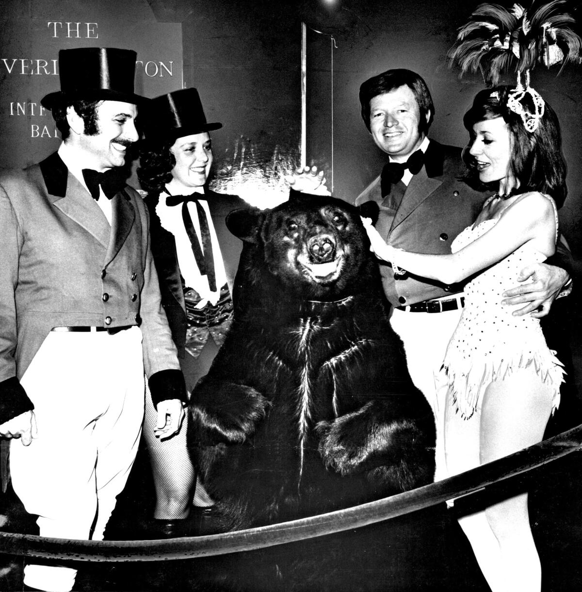 Bruno the bear is a star attraction at the 1973 Bachelors Ball, themed "circus daze." Bestowing attention (and Tootsie Rolls) are, from left, Valerio Giannini, Suzanne Murphy and Dr. Kingsley Fife along with Delores Thedford.