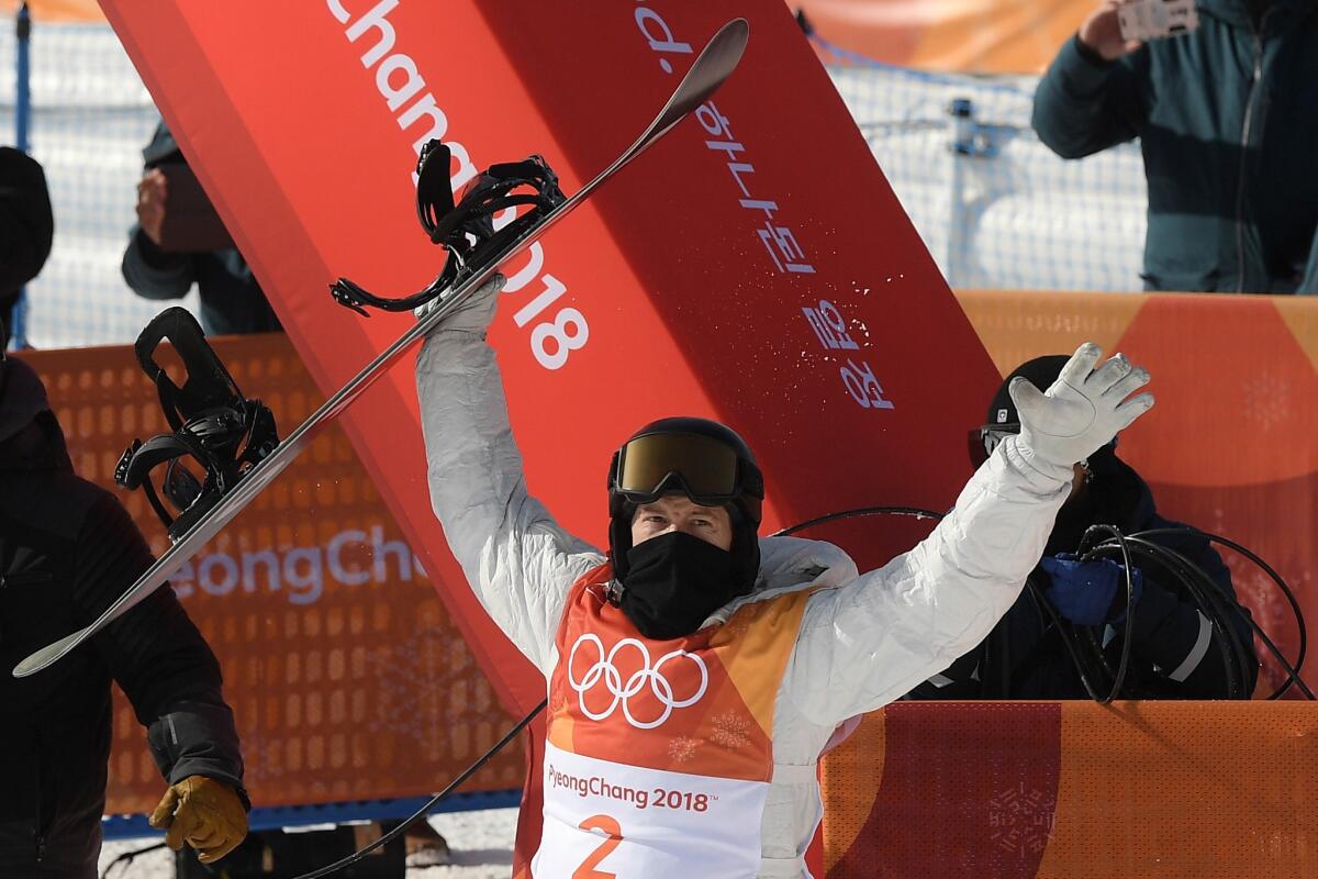 Shaun White celebrates after his second qualifying run during the men's snowboard halfpipe competition.