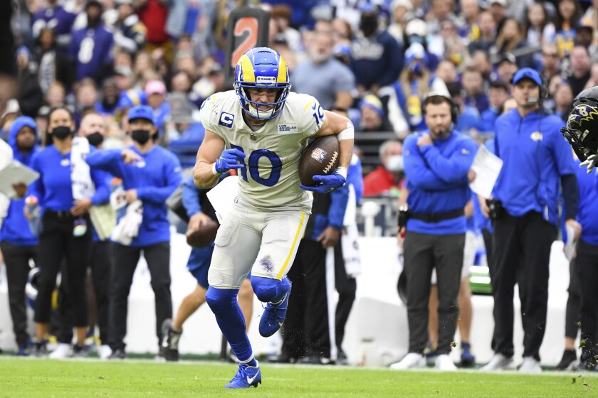 Rams wide receiver Cooper Kupp runs with the ball after a wide-open reception.