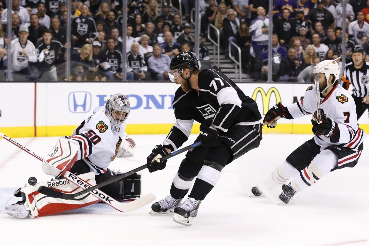 Although Kings center Jeff Carter has his shot deflected by Blackhawks goalie Corey Crawford on this play in the first period, he had one goal and two assists in the 4-3 victory over Chicago in Game 3 on Saturday night at Staples Center.