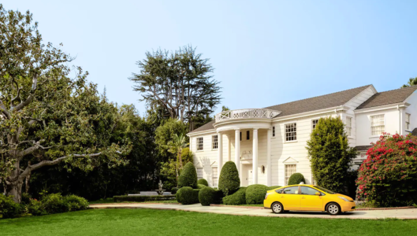 The listing offers access to the master wing, dining room and backyard complete with a swimming pool and outdoor lounge.