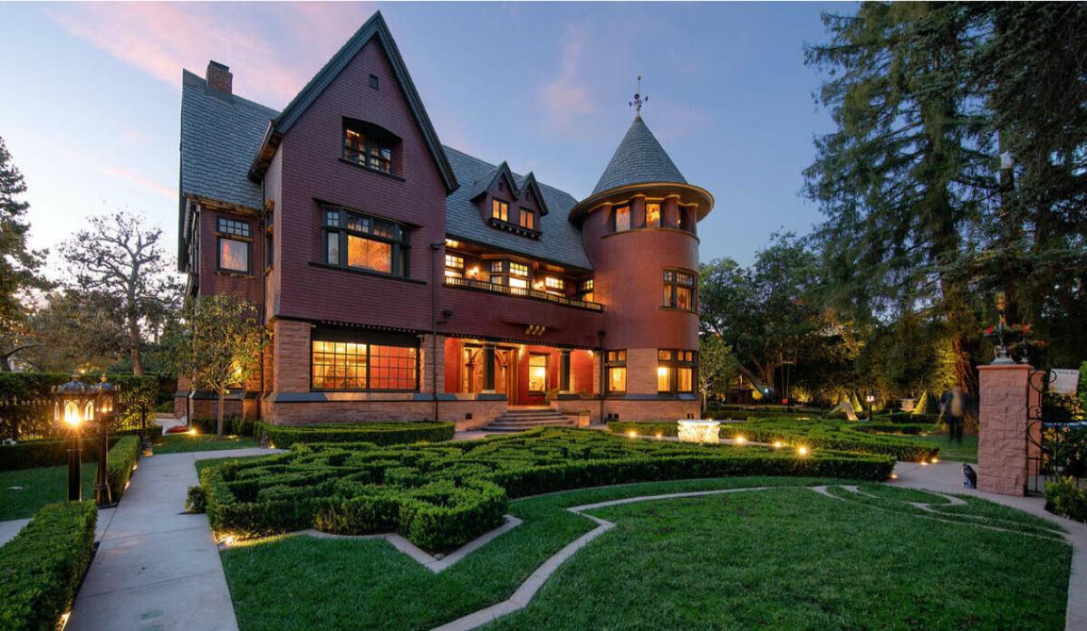 The dramatic Victorian in L.A.'s Windsor Square spans three stories with turrets and period-style spaces.