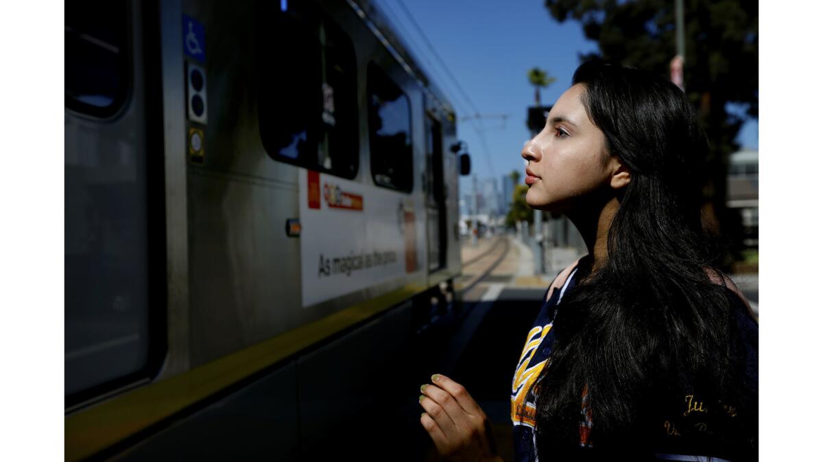 Yecenia Perez, a 17-year-old senior at Orthopaedic Hospital Medical Magnet High School, walks to the train after class. She dreams of going to college: either UC Berkeley or Stanford.