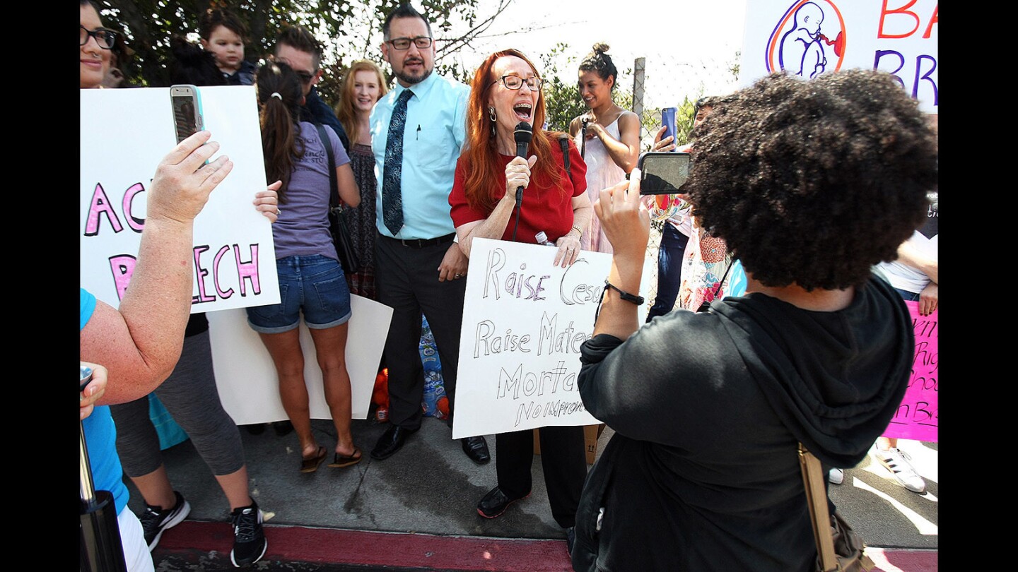 Tonya Brooks, of Woodland Hills, gives comment across from Glendale Adventist Medical Center with 70 people, mostly women, protesting the hospital's ban on vaginal-breech deliveries on Wednesday, Sept. 7, 2016.