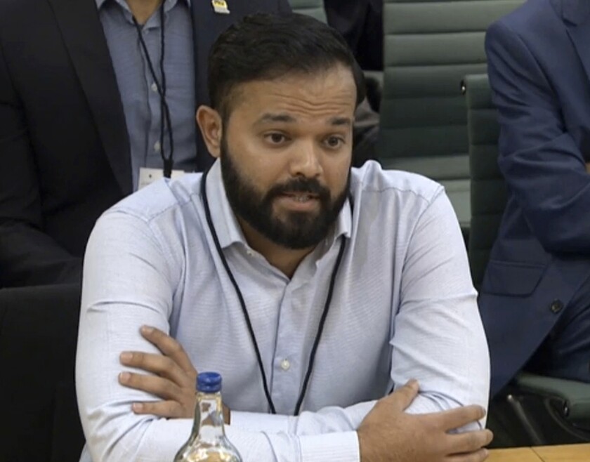 Former cricketer Azeem Rafiq gives evidence during a parliamentary hearing at the Digital, Culture, Media and Sport (DCMS) committee on sport governance at Portcullis House in London, Tuesday, Nov. 16, 2021. Former Yorkshire player Rafiq reported that former national captain Michael Vaughan used racially insensitive comments toward a group of players of Asian ethnicity at county club Yorkshire. (Video grab House of Commons via AP)