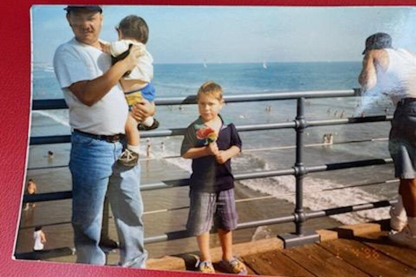 Carlos Ernesto Escobar Mejia with two of his nephews about 20 years ago.