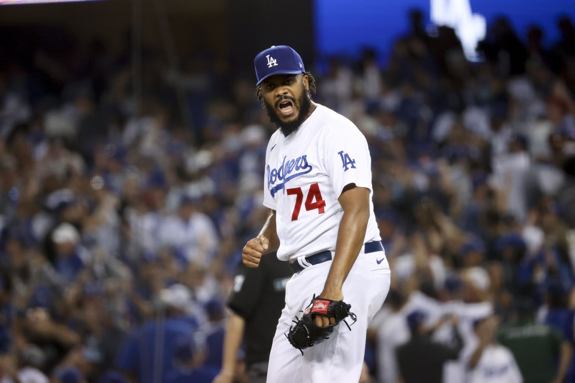 Dodgers relief pitcher Kenley Jansen celebrates on the mound during the ninth inning of a 6-5 win over the Atlanta Braves.