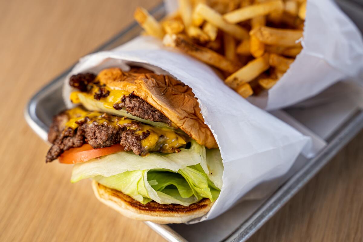 A burger and fries from Hamburger Hut, which recently reopened in a new Encinitas location.