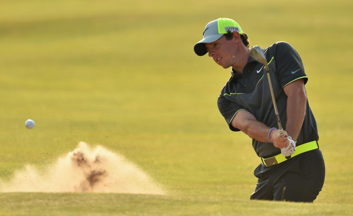 Rory McIlroy of Northern Ireland shoots from a bunker on the 16th hole during the second round of the British Open at Royal Liverpool on Friday in Hoylake, England. McIlroy leads the tournament for the second day in a row after shooting a second six-under-par 66.