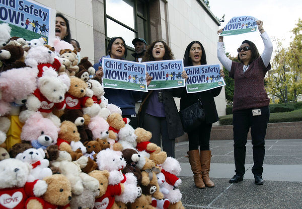 Los Angeles County social workers hold a rally Tuesday in front of the Hall of Administration in downtown Los Angeles to protest their caseloads.