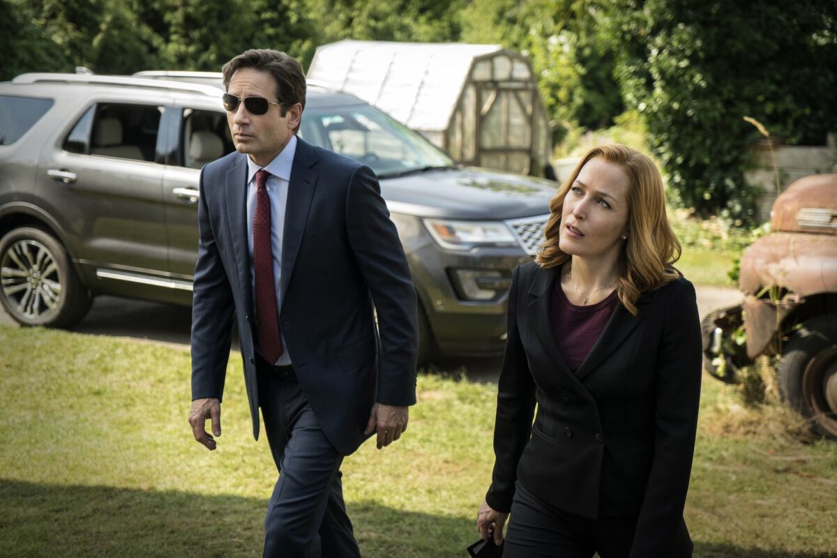 David Duchovny, left, as Fox Mulder, with Gillian Anderson as Dana Scully, got his start on the Fox drama "X-Files." (Ed Araquel/FOX via AP)