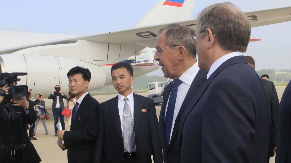 Russian Foreign Minister Sergei Lavrov, second from right, and his delegation arrive at Pyongyang International Airport in North Korea on May 31.