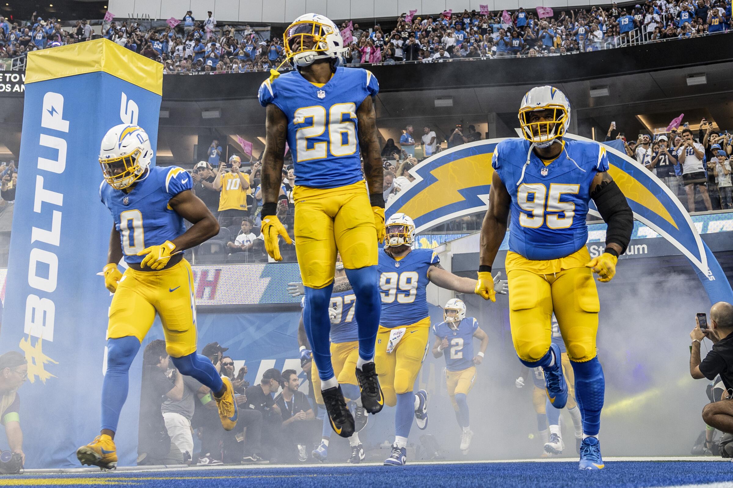 Chargers cornerback Asante Samuel Jr. (26) and his teammates take the field before a loss to the Dallas Cowboys.